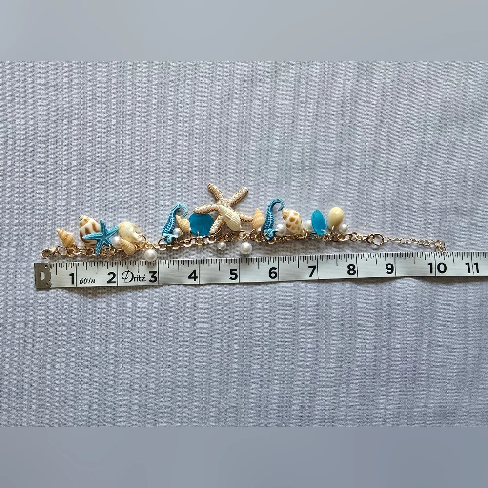 Ocean-Themed Charm Bracelet with Blue‎ and Gold Color Accents